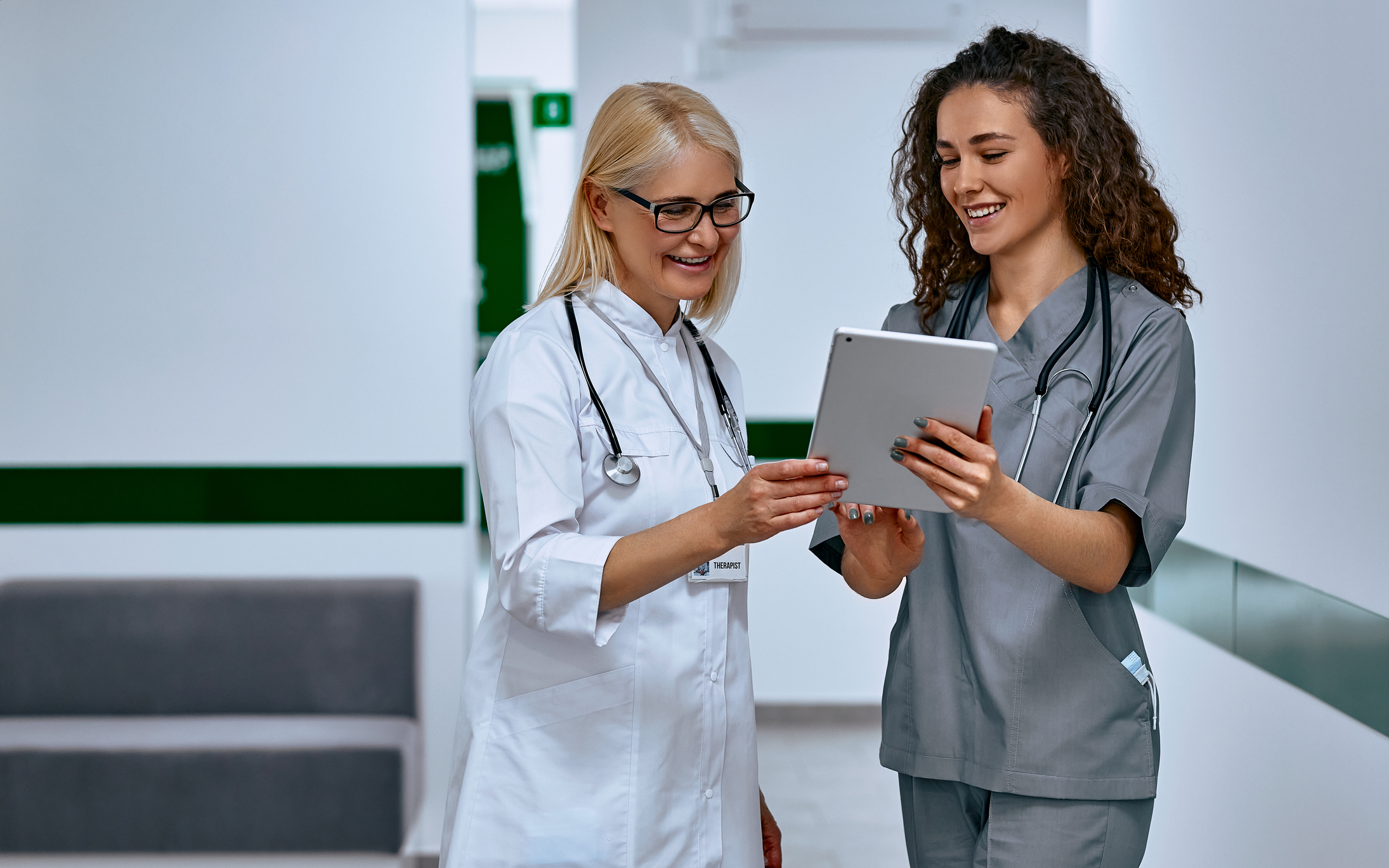 Medical professionals reviewing a tablet together