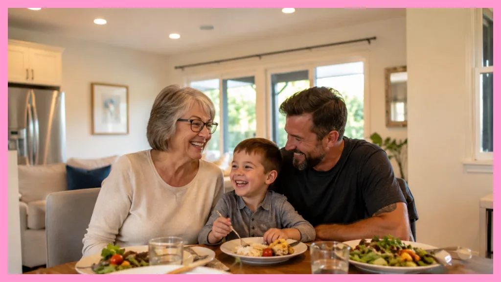 Grandmother, father, and young child sharing a meal and laughing together in a bright family kitchen, illustrating the connection and support of multigenerational living.