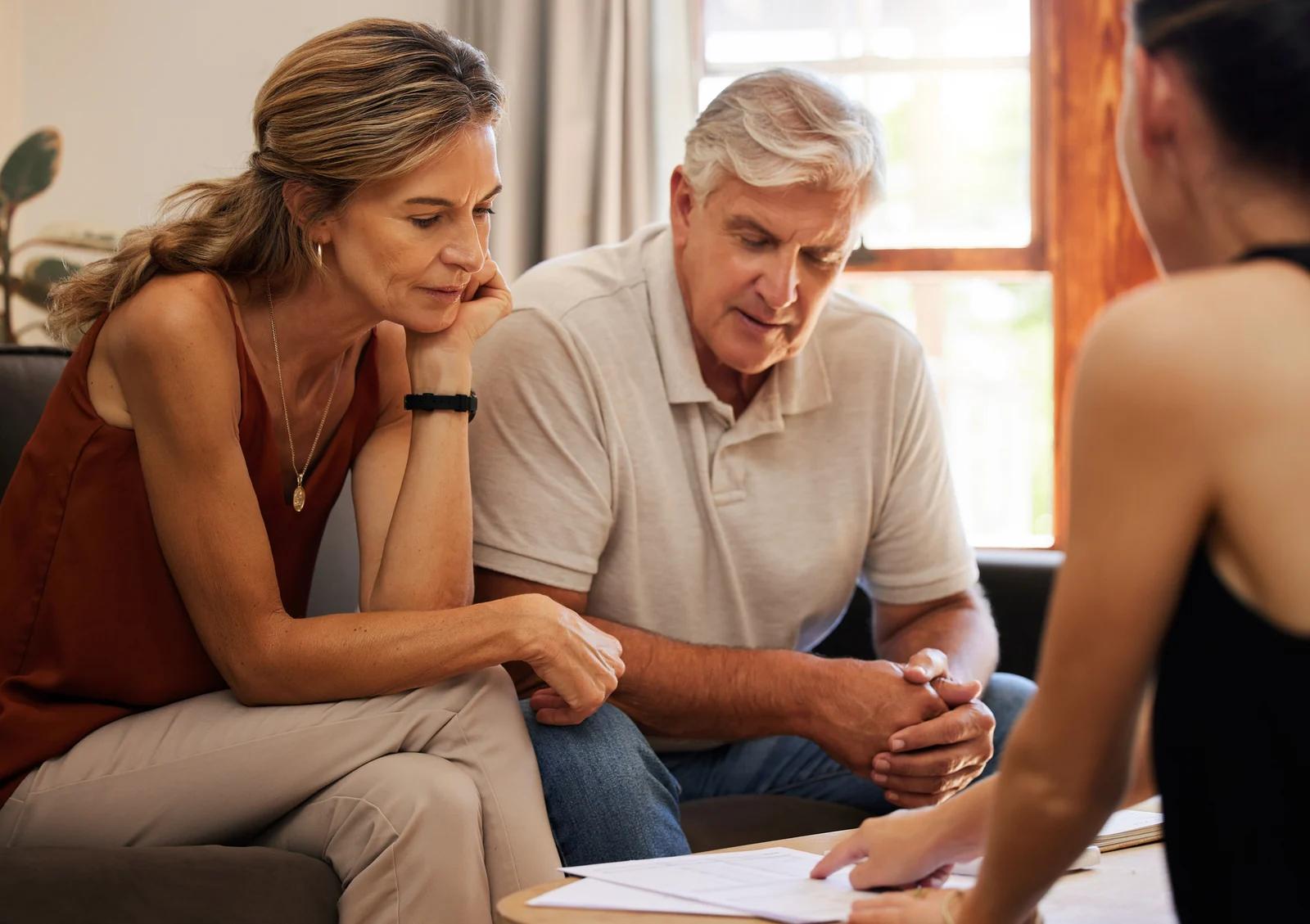 Homeowners reviewing household paperwork at the table