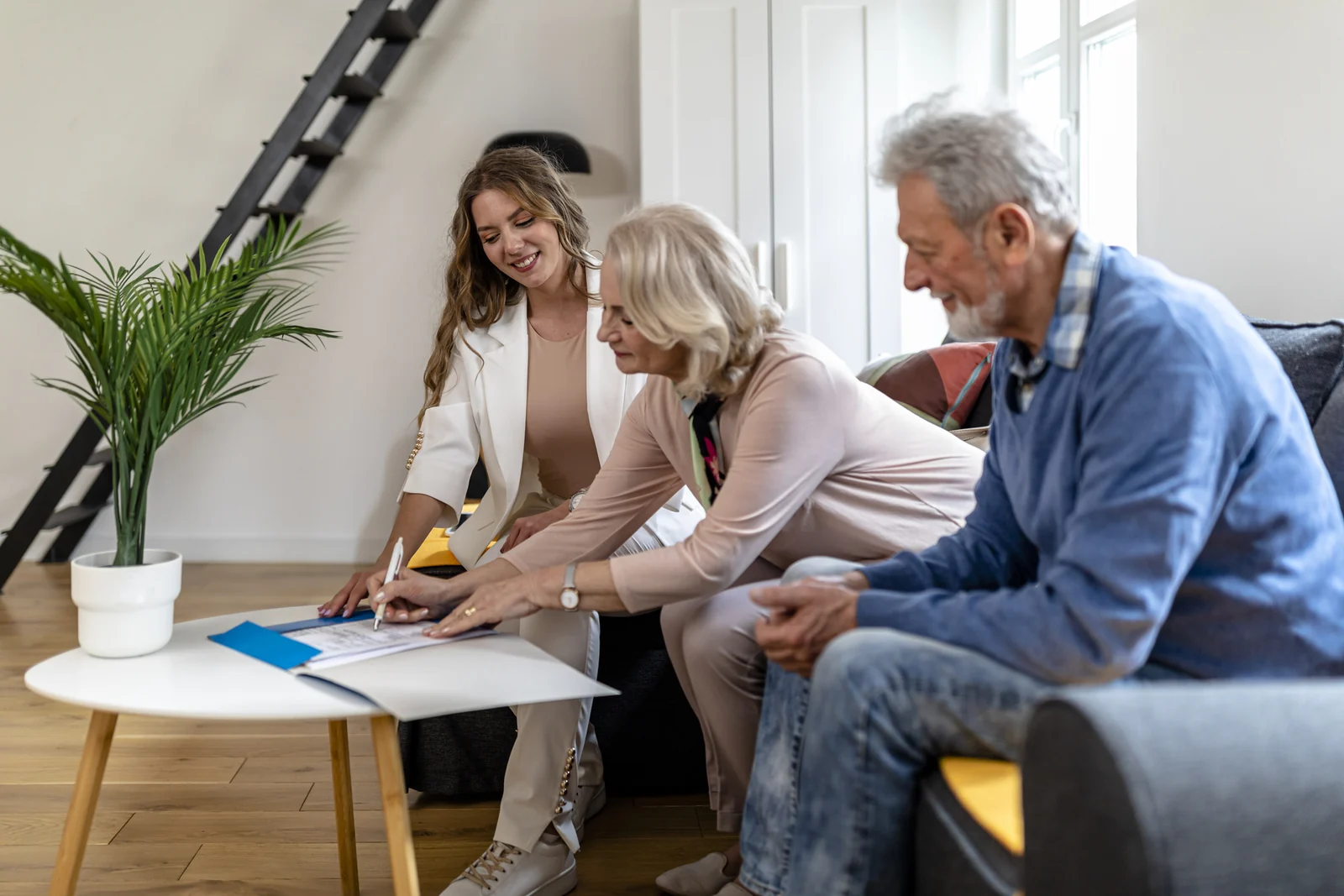 Homeowners looking over a plan for the house they own